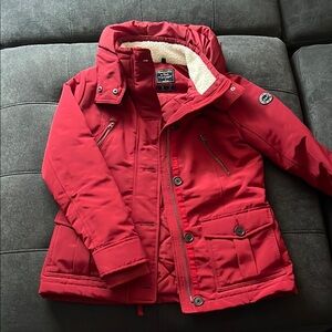 Red Puffer Jacket with High Collar and Insulated Design